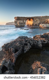 Limestone arch, at sunset know as the Azure Window, in Dwerja, Gozo, Malta.
This location was used as a wedding scene in Game of Thrones, as Daenerys Targaryen marries the Dothraki warlord Khal Drogo.