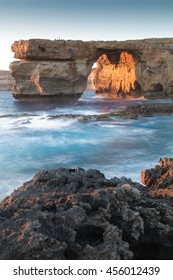 Limestone arch, at sunset know as the Azure Window, in Dwerja, Gozo, Malta.
This location was used as a wedding scene in Game of Thrones, as Daenerys Targaryen marries the Dothraki warlord Khal Drogo.