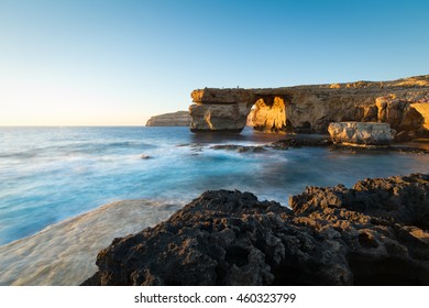 Limestone arch, at sunset know as the Azure Window, in Dwerja, Gozo, Malta.
This location was used as a wedding scene in Game of Thrones, as Daenerys Targaryen marries the Dothraki warlord Khal Drogo.