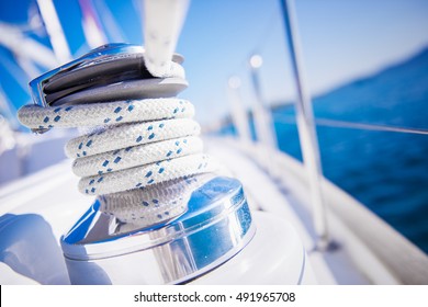 Sailboat winch and rope yacht detail. Yachting