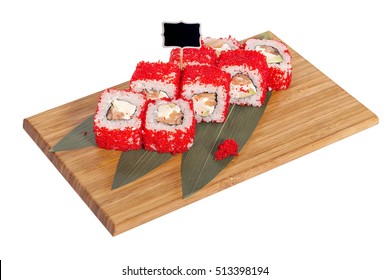 Sushi rolls on wooden Board with leaves of leeks and black sign for logo and name