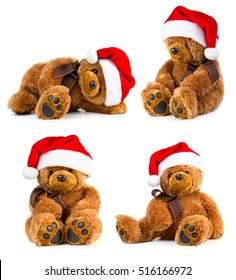 Four toy teddy bear wearing a santa hat isolated on white background