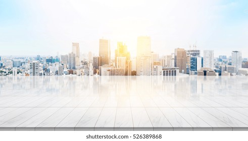 Business concept - Empty marble floor top with panoramic modern cityscape building bird eye aerial view under sunrise and morning blue bright sky of Tokyo, Japan for display or montage product