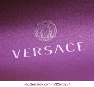 purple versace logo