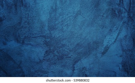 美しい抽象的なグランジ装飾的なネイビー ブルーの暗い漆喰壁の背景。テキストのためのスペースを持つアート ラフ様式化されたテクスチャ バナー