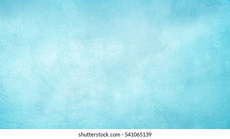Textura de pared de estuco pintado cian azul claro decorativo hermoso abstracto Grunge. Fondo ancho de papel de Navidad de invierno áspero hecho a mano con espacio de copia