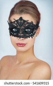 Mask.Nude.Girl.Venice carnival mask Close-up female portrait.Blue eyes.