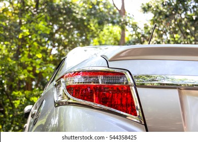 Car taillight on a silver car.