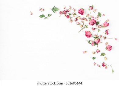 Flowers composition. Frame made of dried rose flowers on white background. Flat lay, top view, copy space