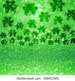 Abstract green glitter sparkle confetti background or party invite with lucky Irish Shamrock clovers for St Patrick’s Day sale flyer, Ireland celebration, card, Spring texture, luck pattern or poster