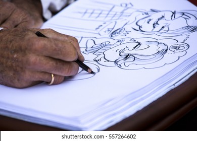 จิตรกรข้างถนนกำลังวาดภาพครอบครัว