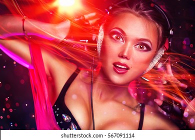 Young sexy brunette woman dj with headphones portrait. Anime style portrait with big eyes and energy flow effect.