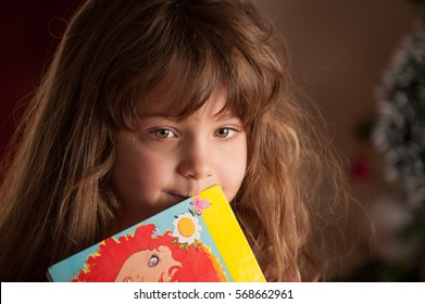 Portrait of a little girl with her favorite fairytale book