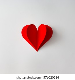 Paper heart shape decoration on white background. Love concept. Flat lay.