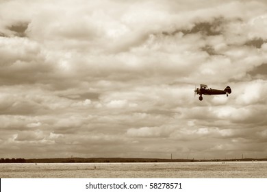World War II fighter flying at low altitude, performing a fly-by. The ground is not totally crisp because of a slight panning. No sharpening was applied.