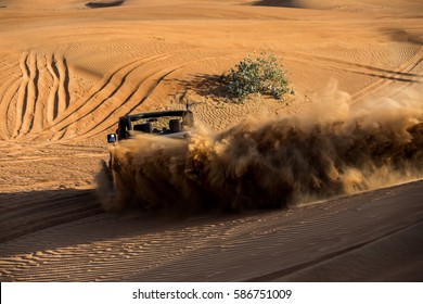 Offroad desert vehicle safari among the sand dunes in Dubai Desert 
