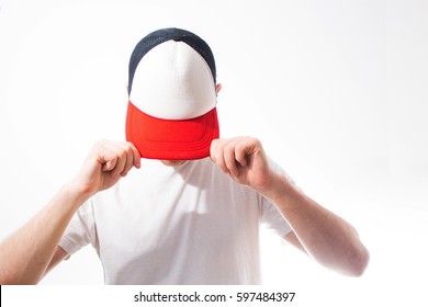 the man, guy in the blank white, red baseball cap,  on a white background, mock up, free space, logo presentation , template for print,  design, 