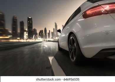 Car goes to a city at dusk