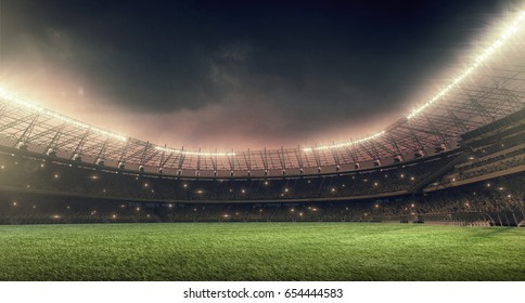 イルミネーションと緑の芝生と夜空のサッカー スタジアム