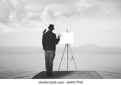 creative black and white painter observing the mist to find inspiration