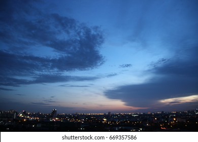 dark blue cloud with white light sky background and city light midnight evening time  