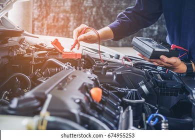 Hands of car mechanic  working in auto repair service.