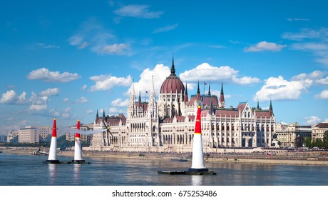 contrail of sport aircraft race at the airshow in front of the parlament in Budapest above Danube