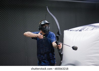 Man with crossbow arrows bow. The Archer takes aim, sharpshooter. Crossbow club.