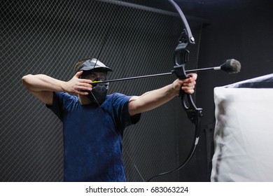 Man with crossbow arrows bow. The Archer takes aim, sharpshooter. Crossbow club.