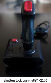 Joystick arcade game room 80's of black color with red buttons