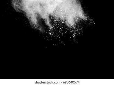 Abstract powder splatted background,Freeze motion of color powder exploding/throwing color powder, color glitter texture on black background