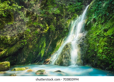 Xiao Yintang Waterfall of Yangmingshan National Park with milky cold spring and sunlight on sunny day, shot in Taipei, Taiwan.