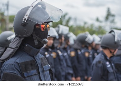 Police riot used shields and batons to practice outdoors.