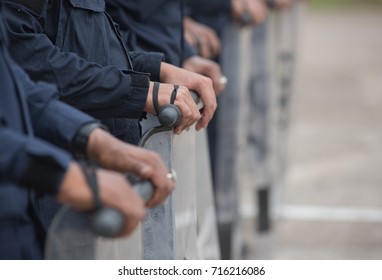 Police riot used shields and batons to practice outdoors.