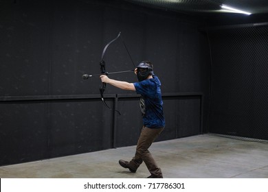 Man with crossbow arrows bow. The Archer takes aim, sharpshooter. Crossbow club.