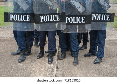 Police riot used shields and batons to practice outdoors.
