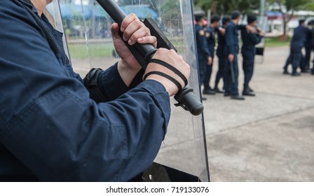 Police riot used shields and batons to practice outdoors.