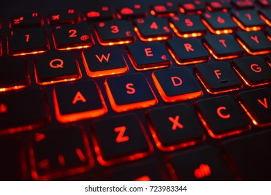 Gaming keyboard on laptop with red light - Close up