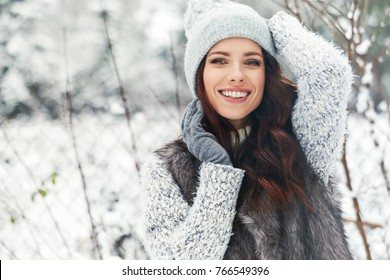 beautiful smiling young woman in wintertime outdoor. Winter concept