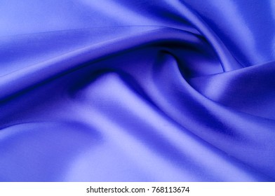 Soft focus. texture, pattern. fabric silk blue. Inside, elegantly with blue midnight light, add this Italian Silk Crepe Back Satin to your design. Silky smooth with a luminous satin face