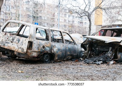 Totally destroyed cars burned in fire in the war zone or in civil demonstrations close up