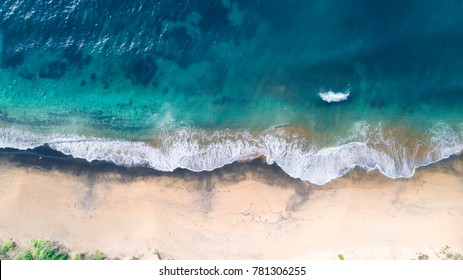 Aerial View of Waves and Beach on Early Morning
