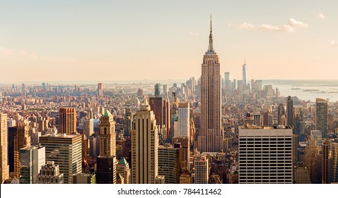Manhattan Midtown Skyline with illuminated skyscrapers at sunset. NYC, USA