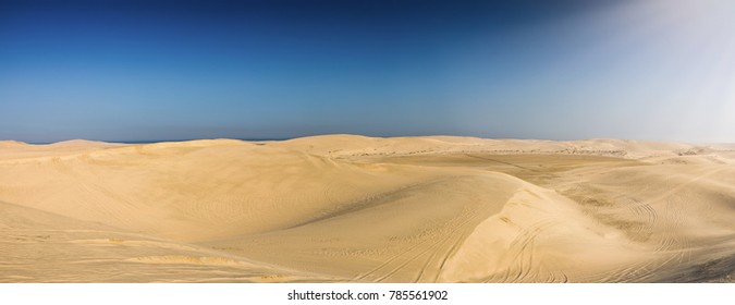 Panorama of the desert of Qatar leading to the inland sea