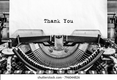 Vintage typewriter on white background with text thank you.. Close up.