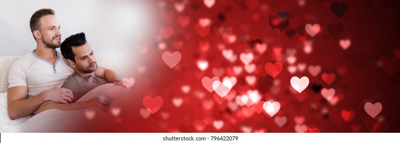 Compuesto digital de una pareja gay en la cama con corazones de transición de amor de San Valentín