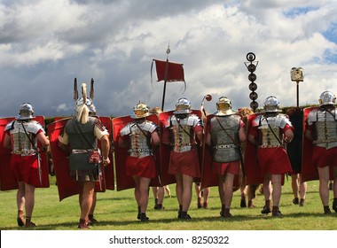 Roman Legion Marches on to War with swords drawn under Stormy Skies in Northumberland, England