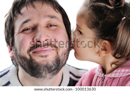 Little girl kissing her father