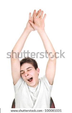 yawning teenager with hands up on the white background