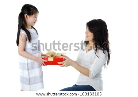 Little Asian girl arms out holding a beautiful wrapped present.